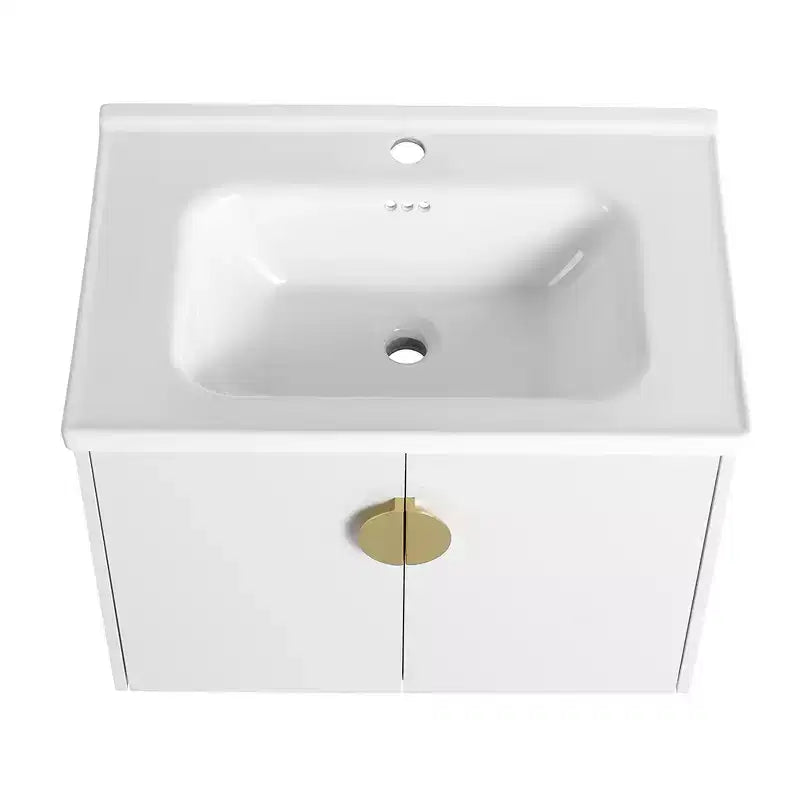 Meuble-lavabo moderne avec vasque en céramique, portes à fermeture douce et finition blanc brillant résistante aux rayures.