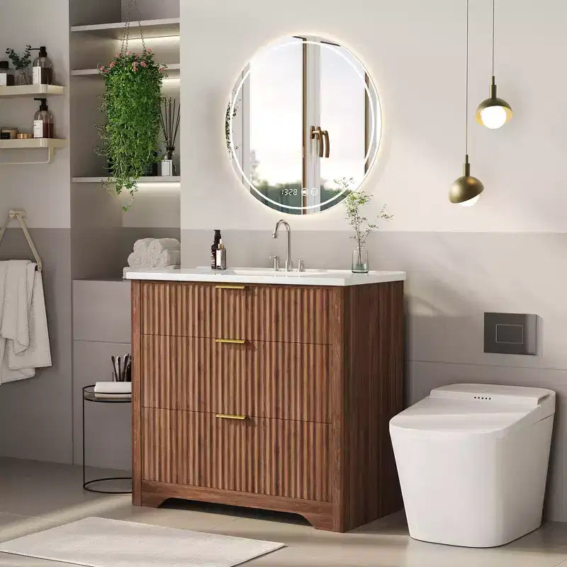 Meuble-lavabo de salle de bain moderne cannelé avec lavabo en céramique intégré, armoire de rangement autoportante avec 3 tiroirs pour salle de bain contemporaine.