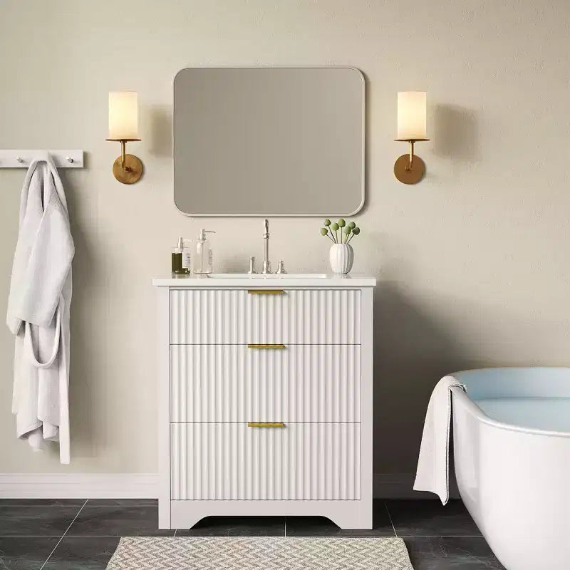 Meuble-lavabo de salle de bain moderne cannelé avec lavabo en céramique intégré, armoire de rangement autoportante avec 3 tiroirs pour salle de bain contemporaine.