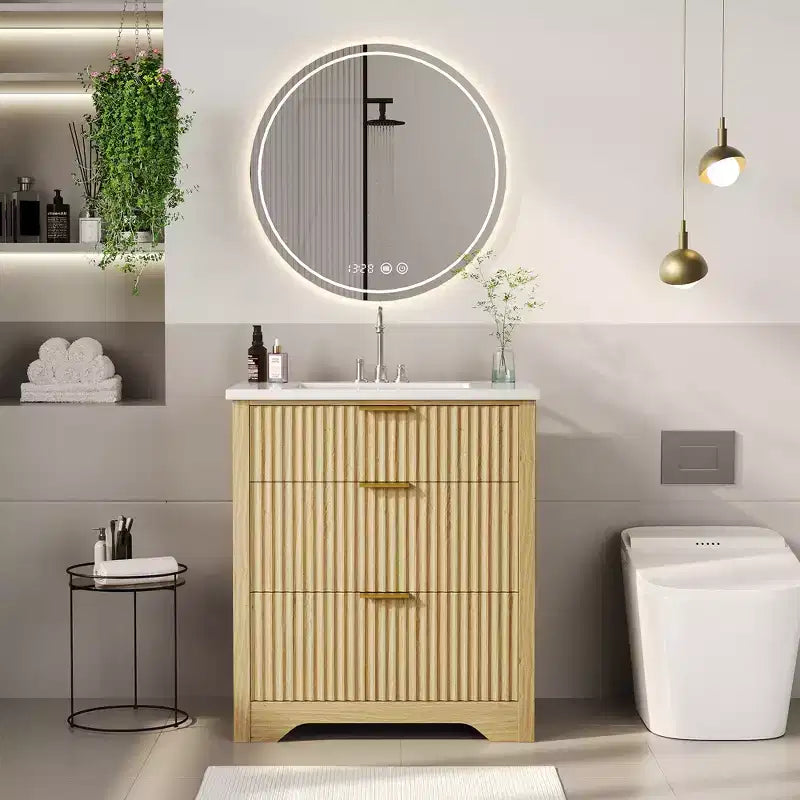 Meuble-lavabo de salle de bain moderne cannelé avec lavabo en céramique intégré, armoire de rangement autoportante avec 3 tiroirs pour salle de bain contemporaine.
